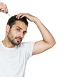 A person applying Cocky's Rosemary Serum for Hair Growth