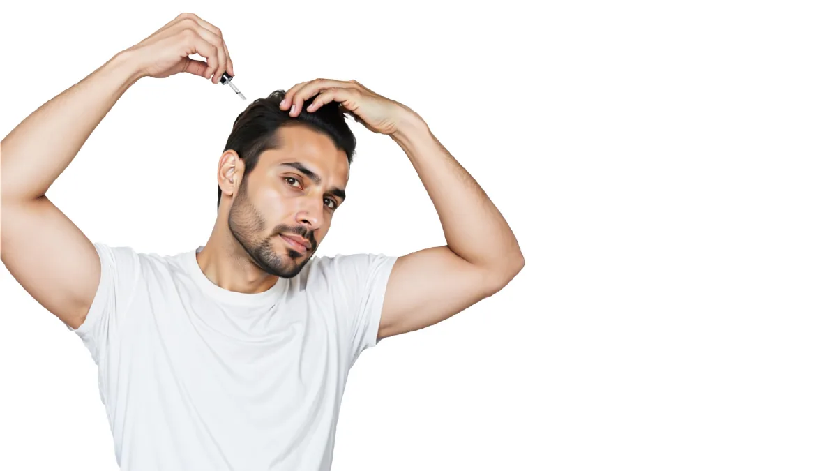 A person applying Cocky's Rosemary Serum for Hair Growth